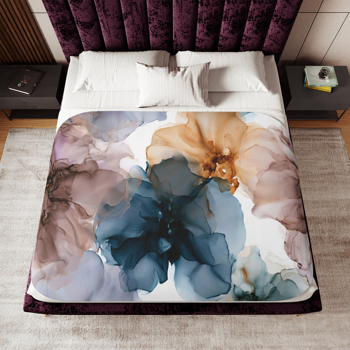 a bed with a floral comforter and pillows
