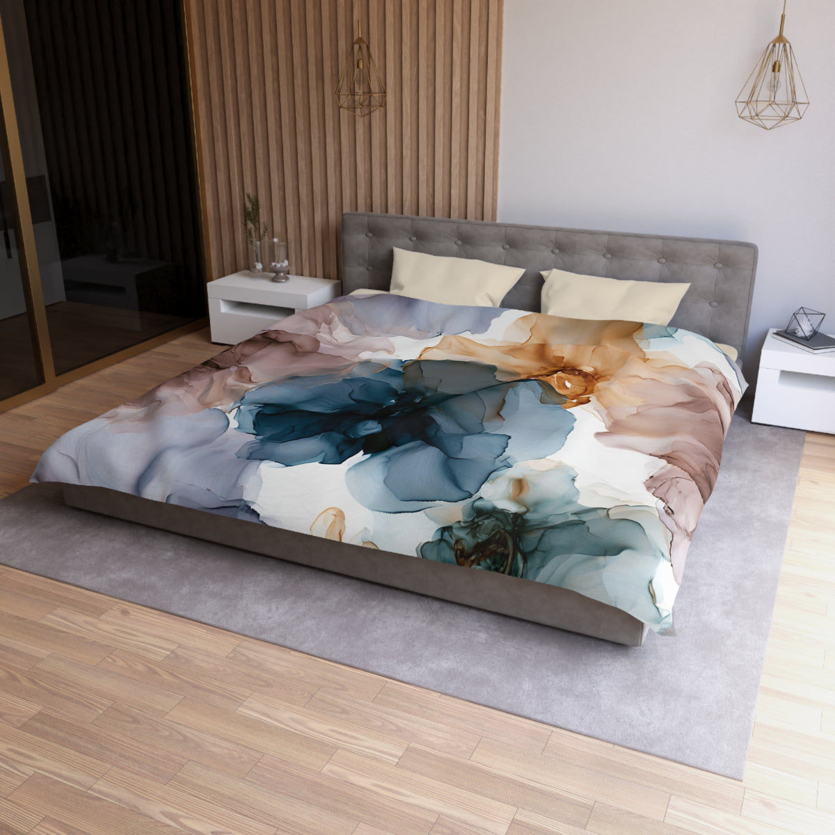 a bed with a floral comforter on top of it