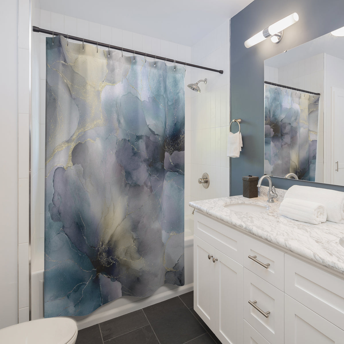 a modern bathroom with a white vanity, a large blue and white floral shower curtain, and a marble countertop.