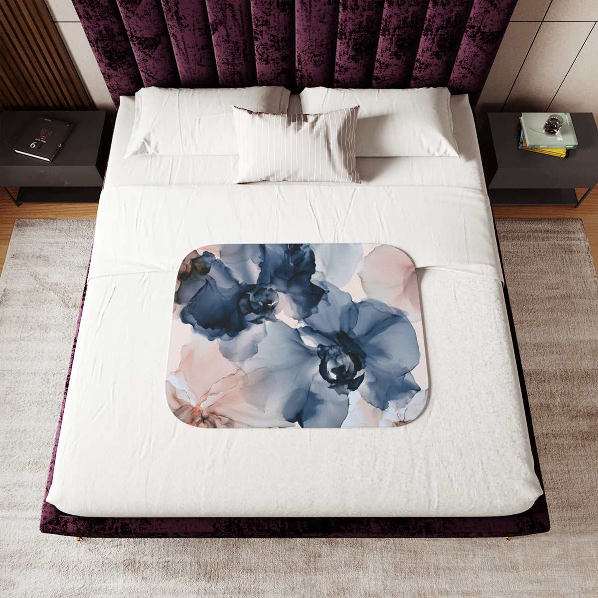 a bed with a purple headboard and a white blanket