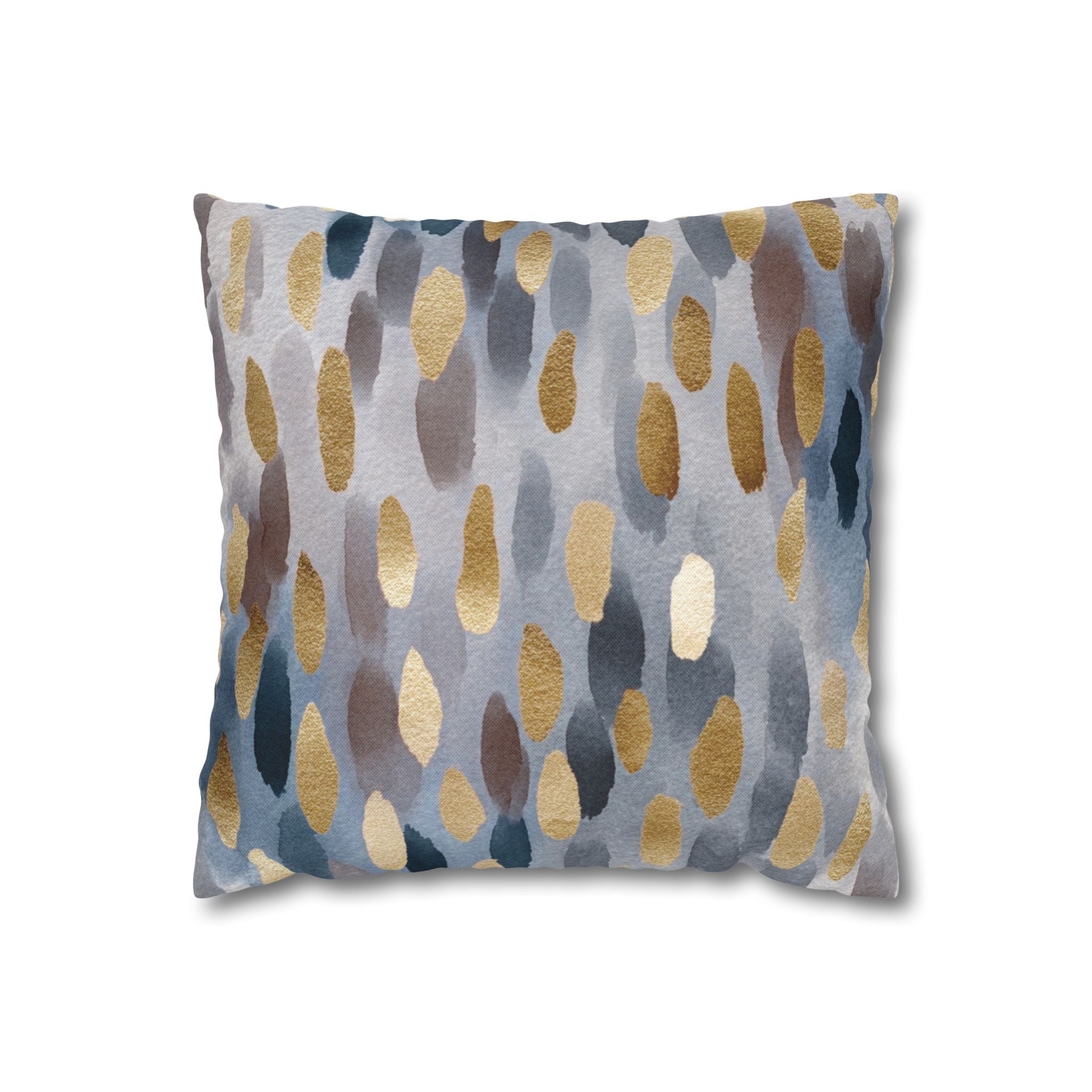 a square pillow with a unique abstract pattern of gold and gray dots on a blue background.