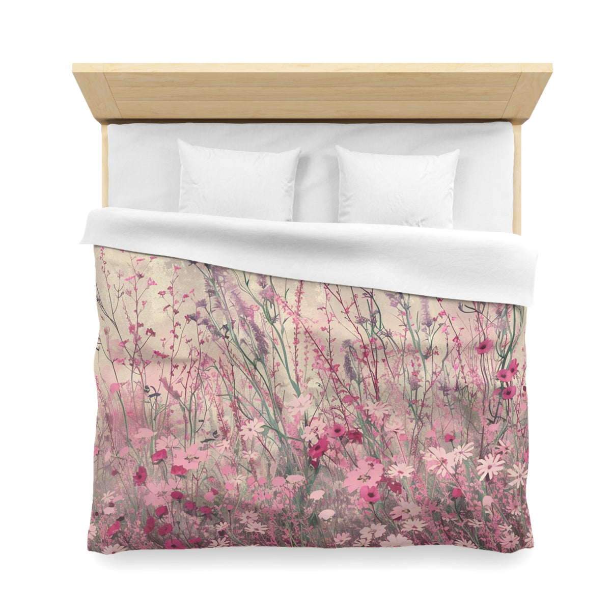 a bed with a floral print duvet cover featuring a field of pink and white flowers.