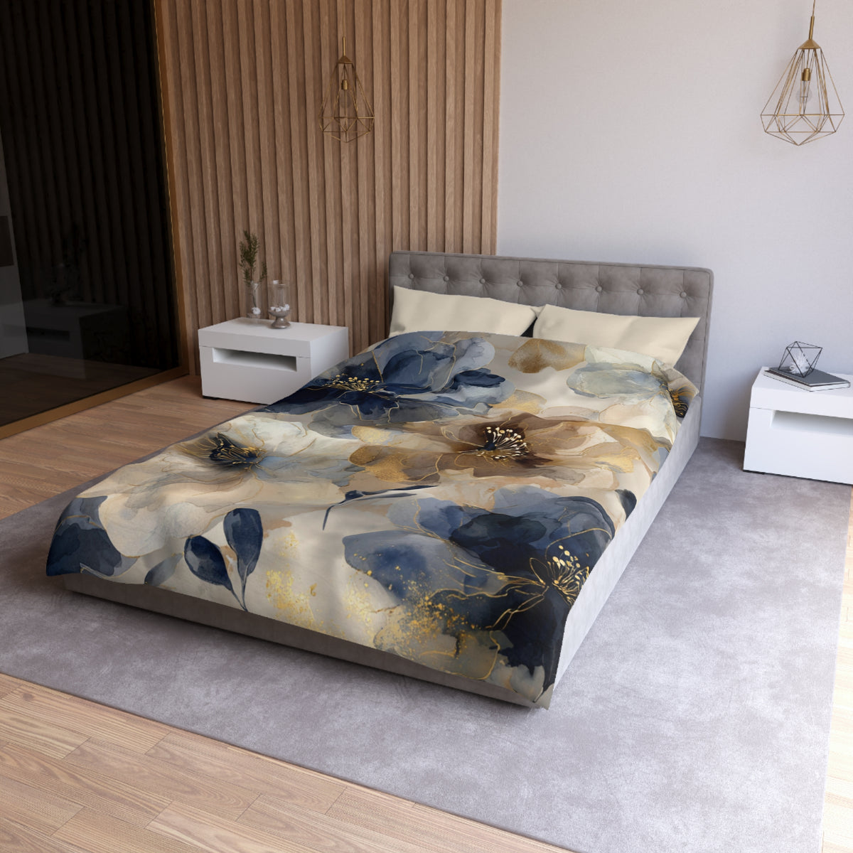a modern bedroom with a large bed covered in a floral print comforter. The bed is positioned against a wall with a wooden panel design. The room has a neutral color scheme with white walls and a gray carpet. There are two nightstands on either side of the bed, and a pendant light hangs above the bed.