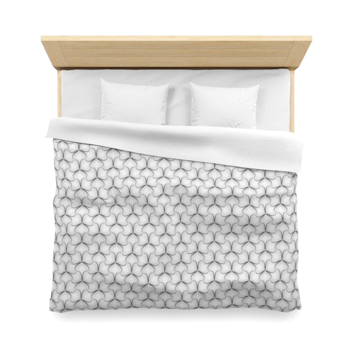 a neatly made bed with a white comforter and pillows.