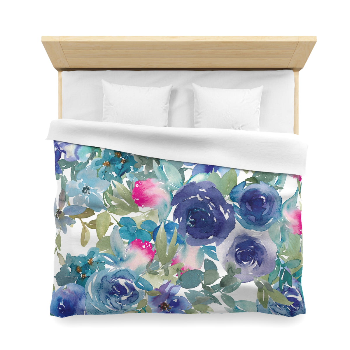 a bed with a floral print duvet cover featuring a variety of colorful flowers and leaves.