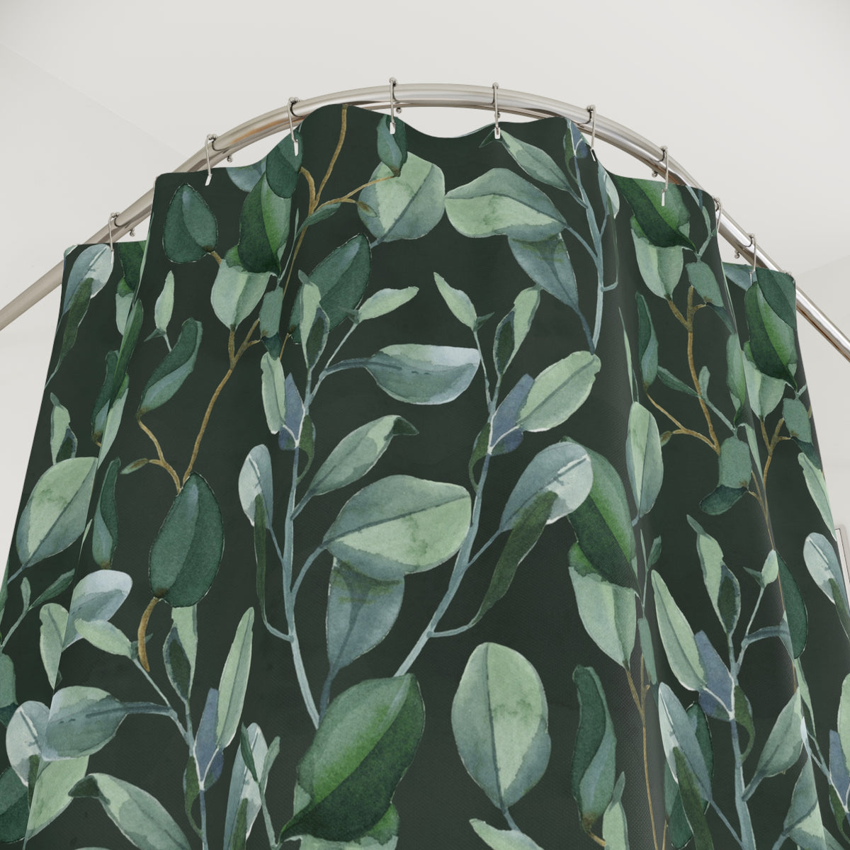 a shower curtain with a green leaf pattern.