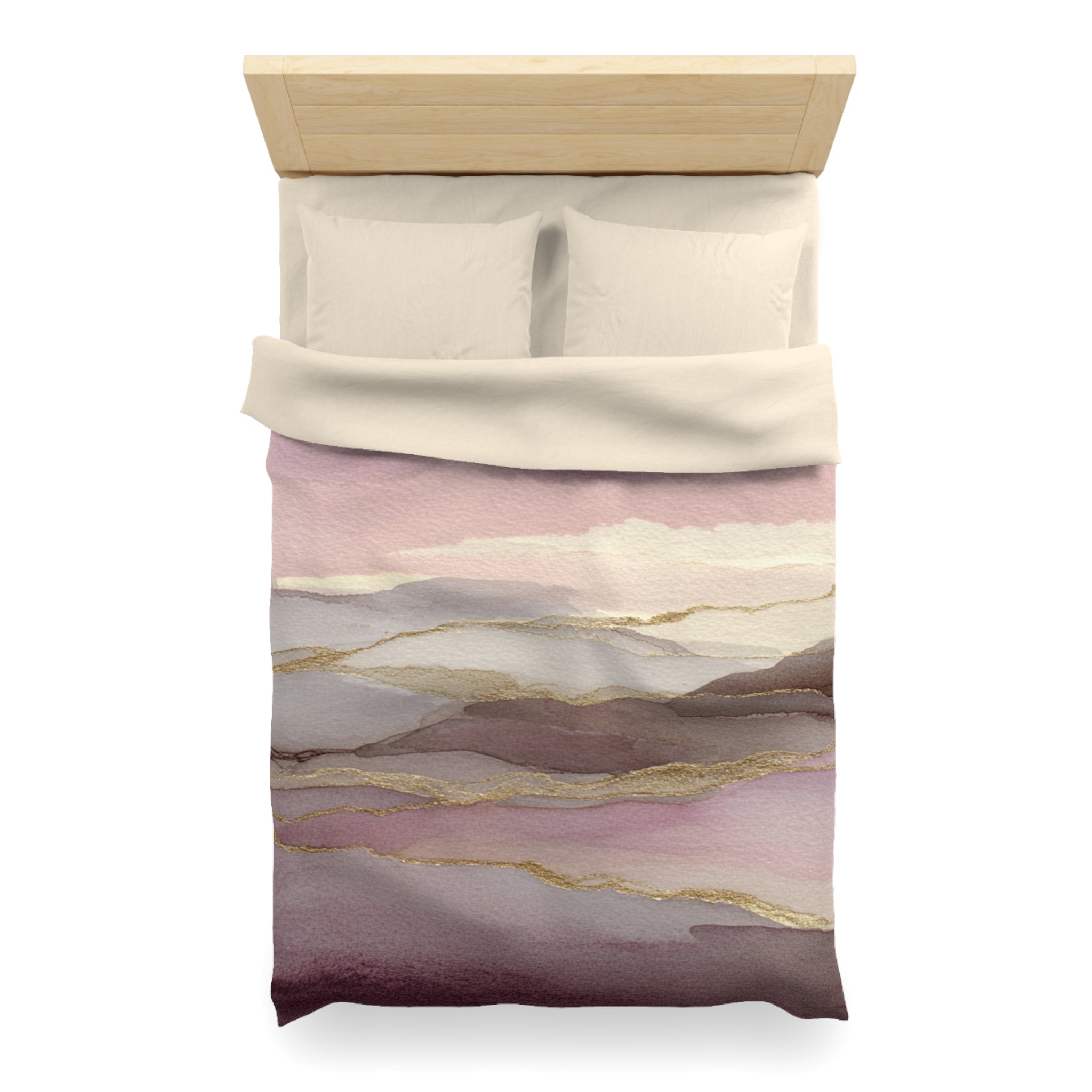 A bed with a white comforter and pillows, featuring a colorful abstract pattern in shades of pink, purple, and gold.