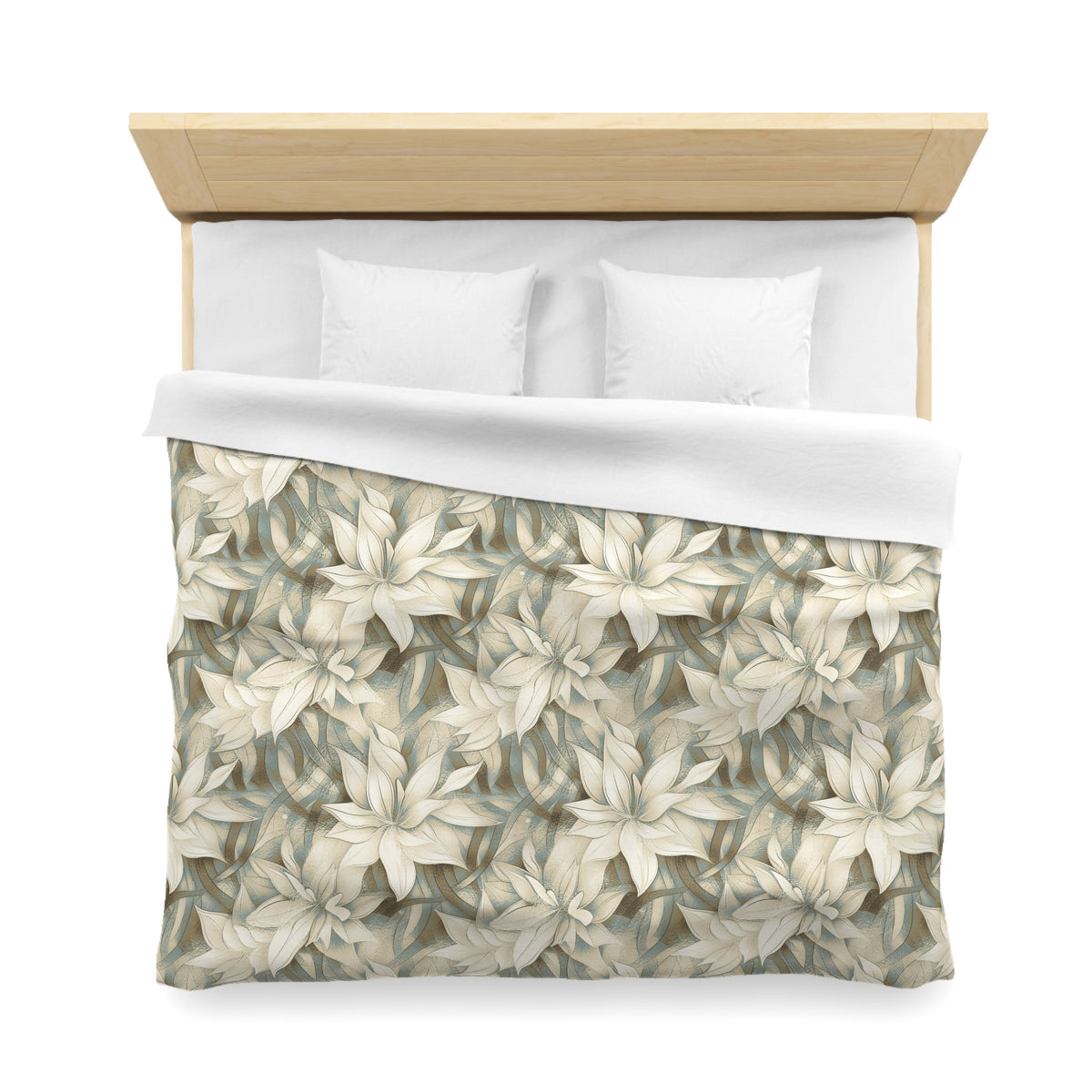 a neatly made bed with a floral patterned comforter and two white pillows.