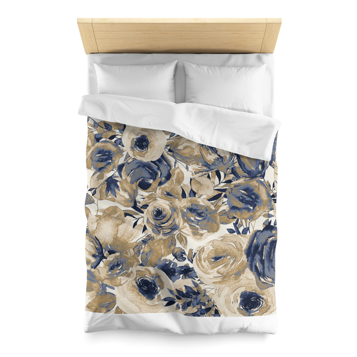 a bed with a floral print duvet cover and pillows. The duvet cover features a design of blue and white flowers, creating a visually appealing and cozy appearance.
