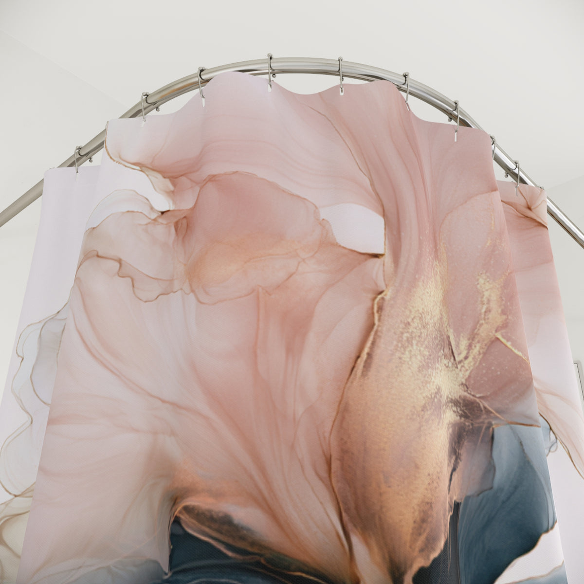 a shower curtain with a pink and gold abstract floral pattern.