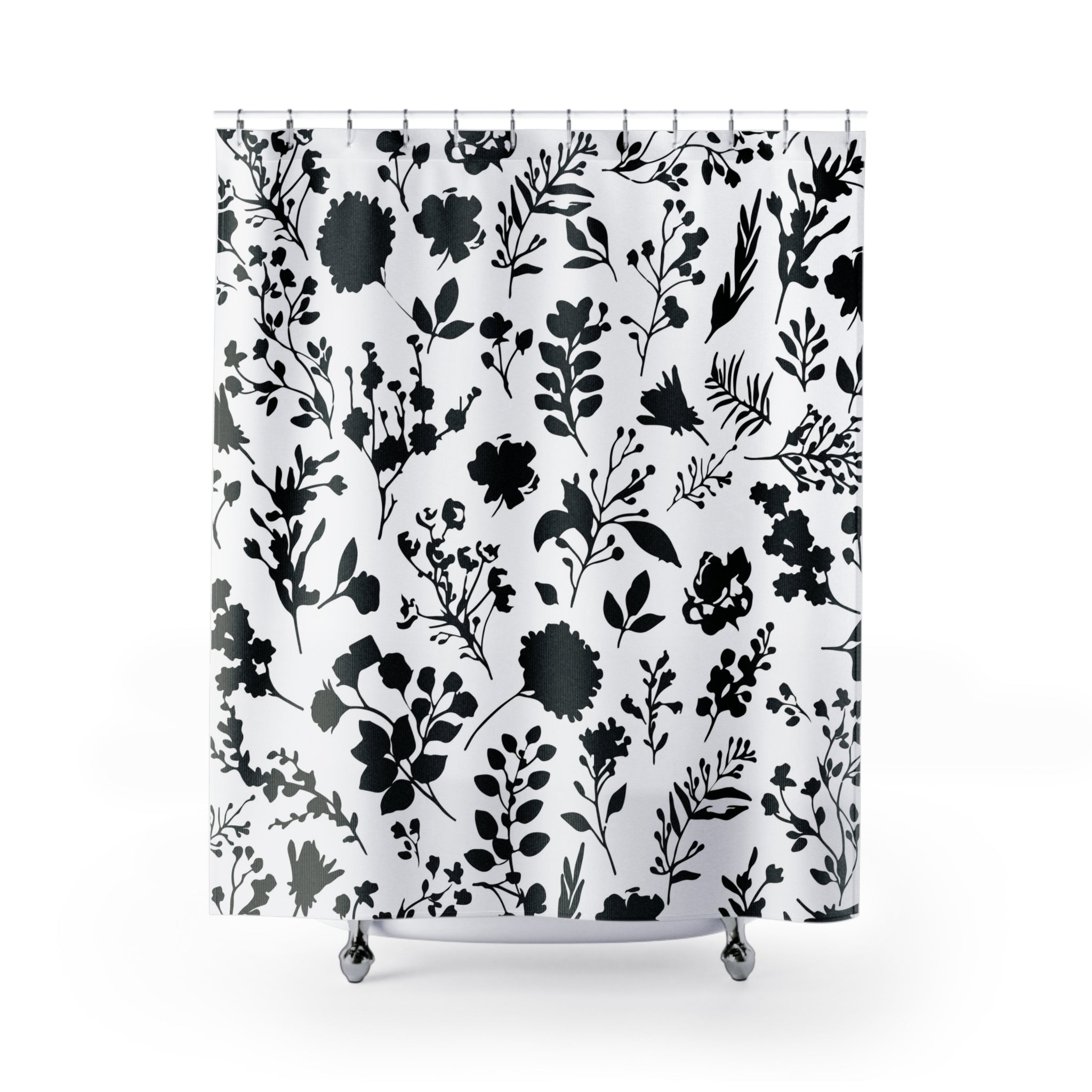 a boho shower curtain with a black and white floral pattern