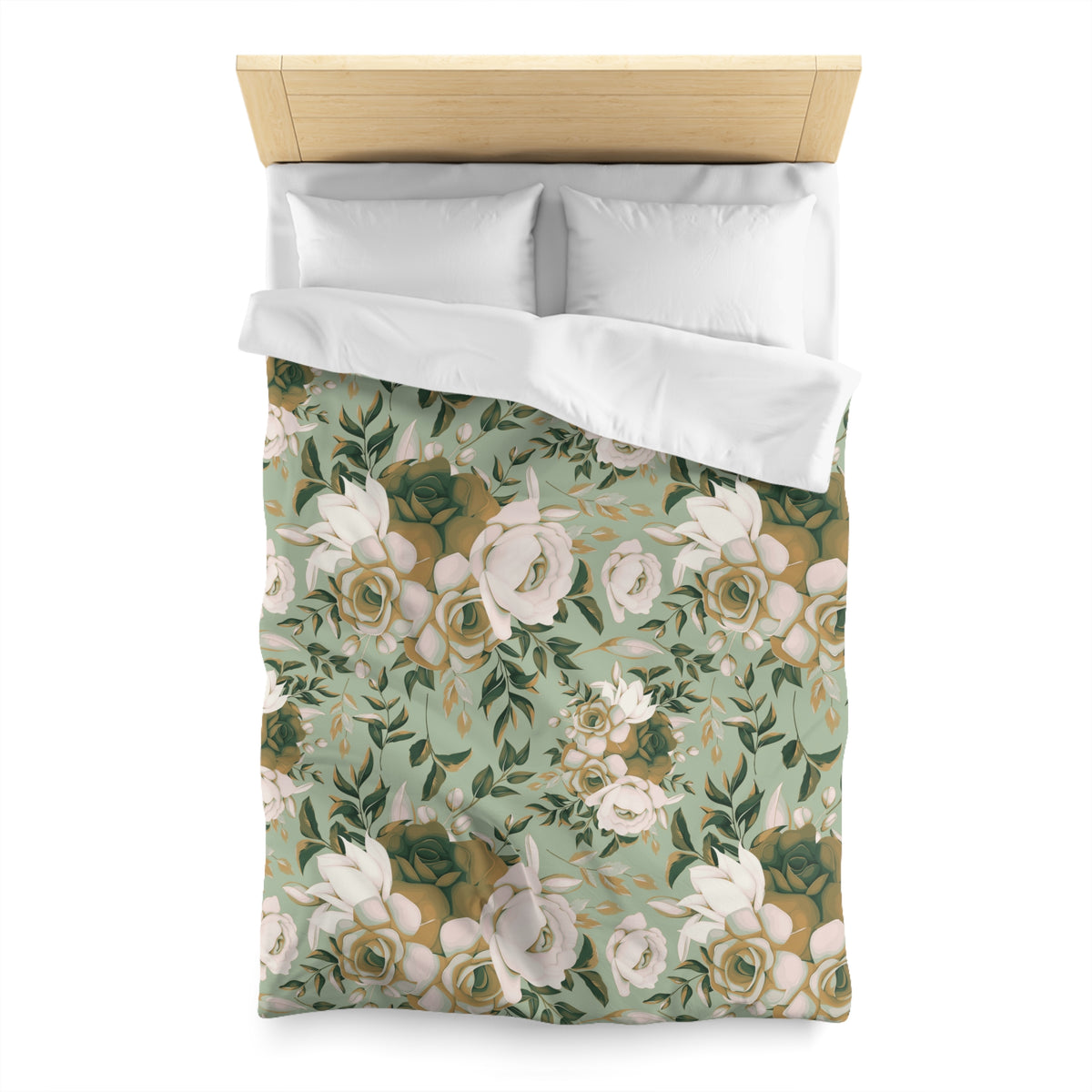 a bed with a floral patterned comforter and pillows.