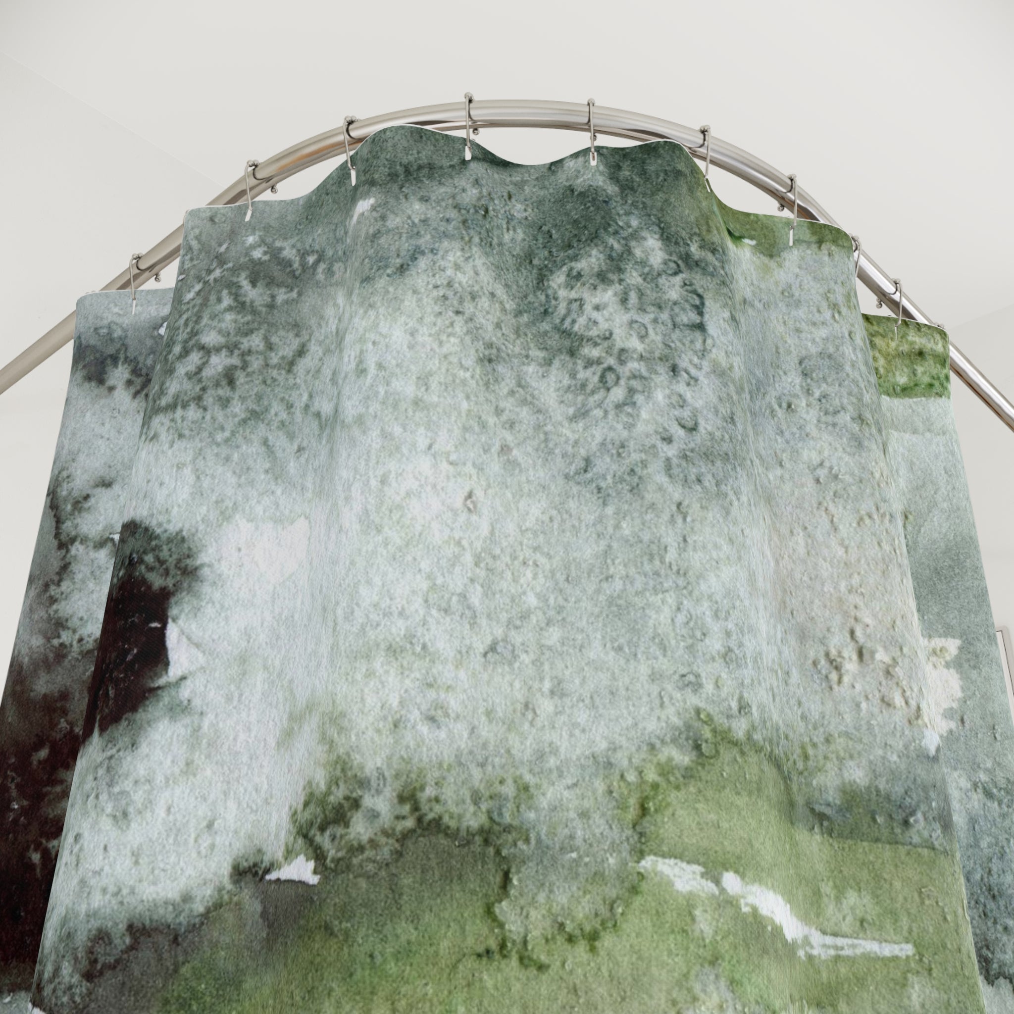 a large, curved shower curtain with a green and white pattern.