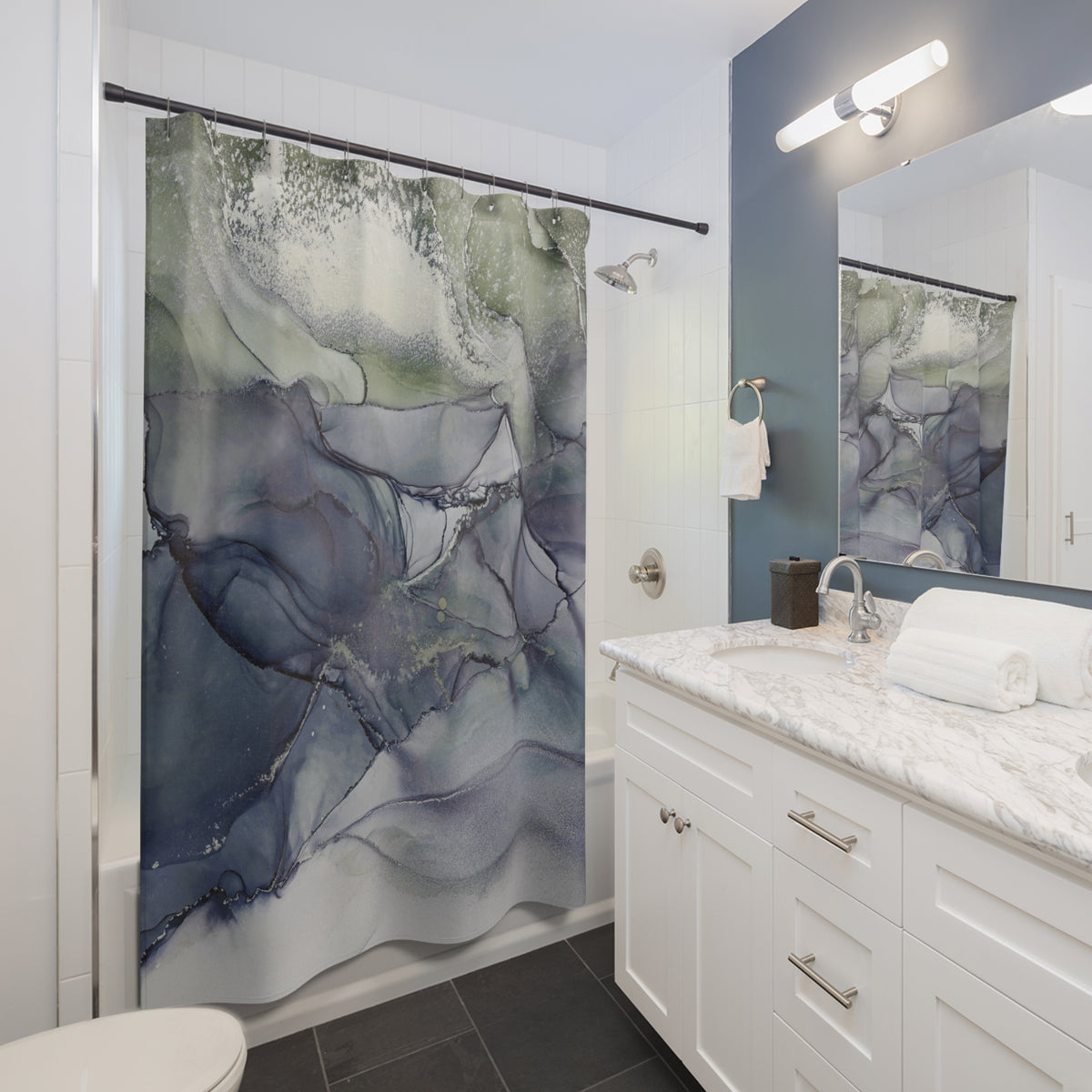 a modern bathroom with a white vanity, a large abstract shower curtain, and a marble countertop.