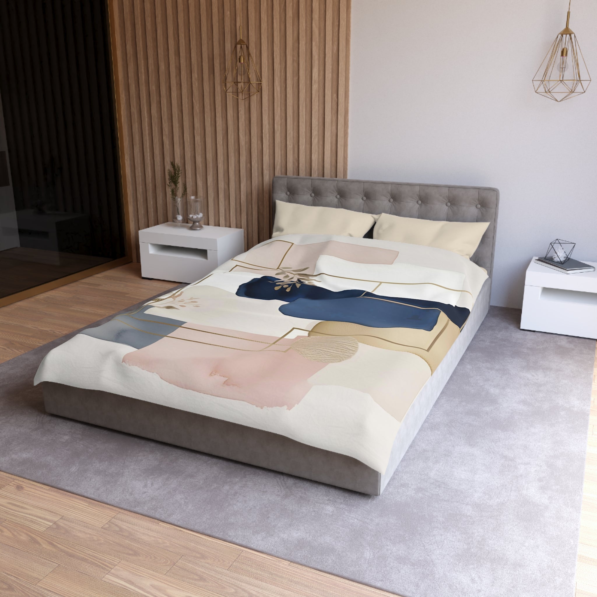 a modern bedroom with a gray tufted headboard, a white bedside table, and a gray area rug. The bed is covered in a colorful abstract patterned comforter.