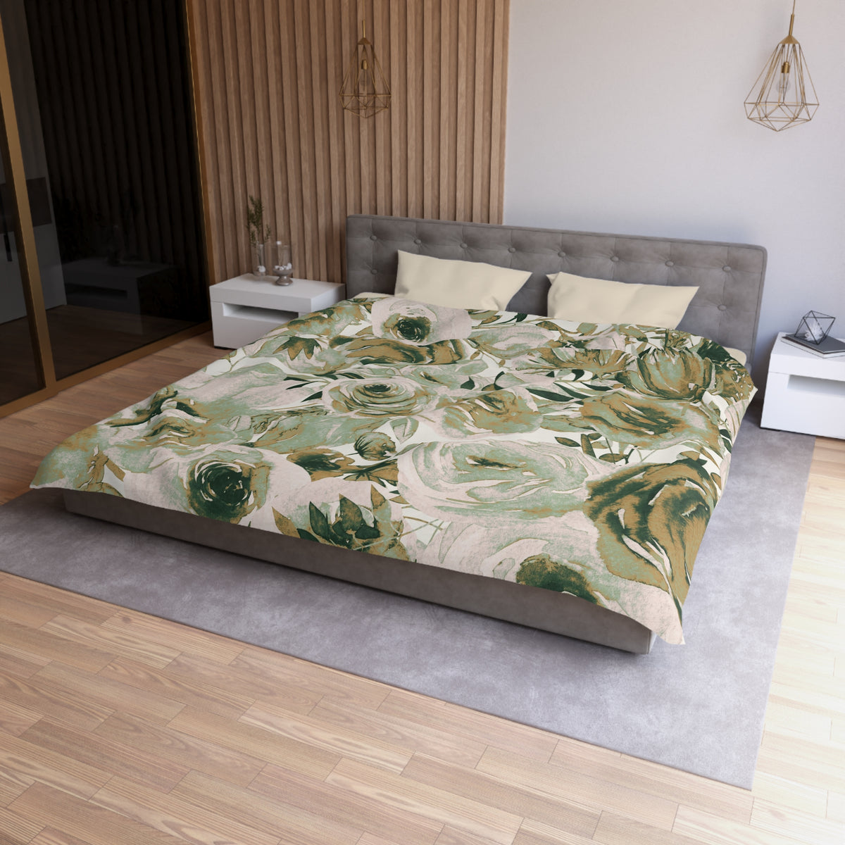 a modern bedroom with a large bed covered in a floral print comforter. The bed is positioned against a wall with a wooden panel. The room has a gray headboard and a white nightstand on each side of the bed. The floor is covered with a gray rug.