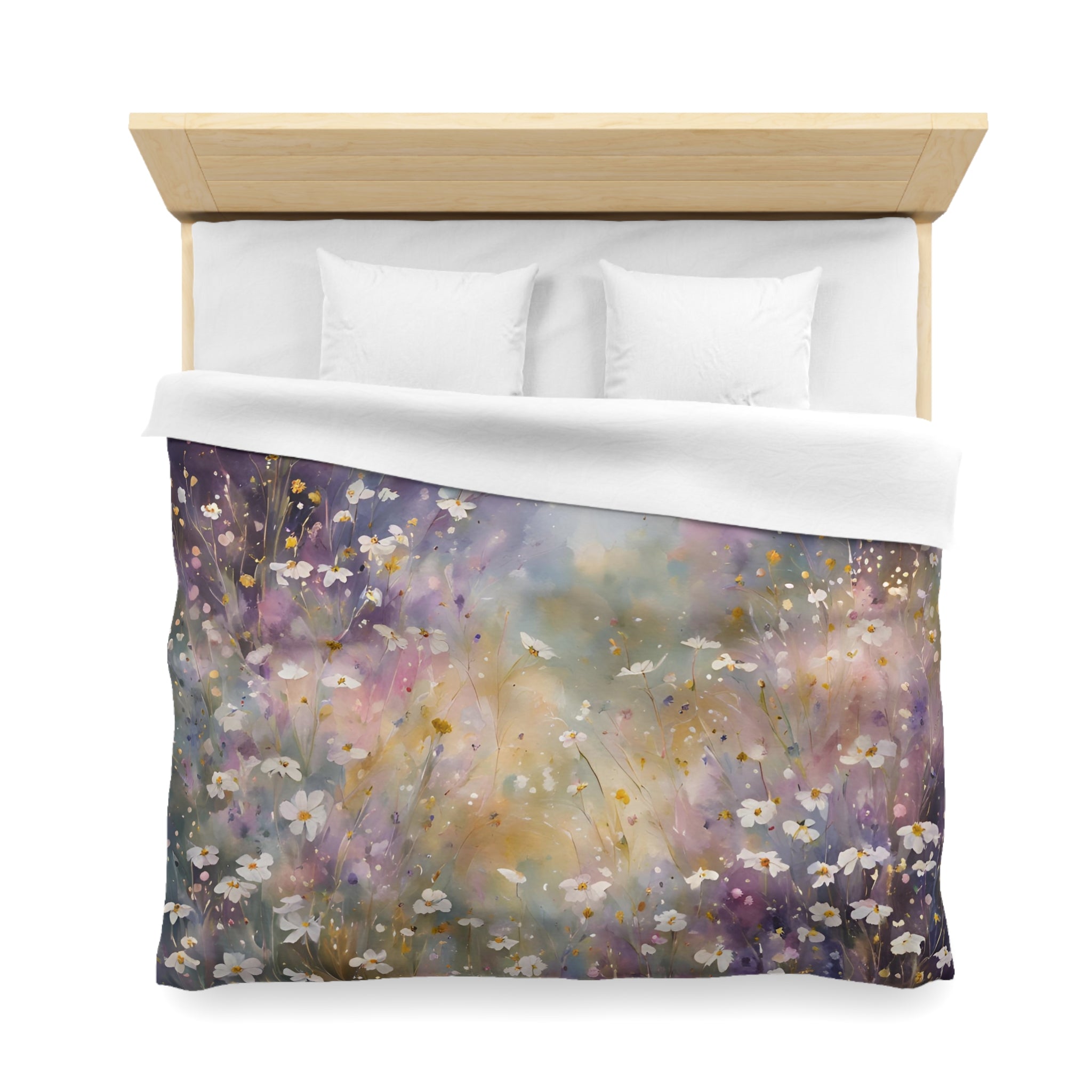 a bed with a colorful floral duvet cover featuring a field of flowers, including daisies, against a white background.