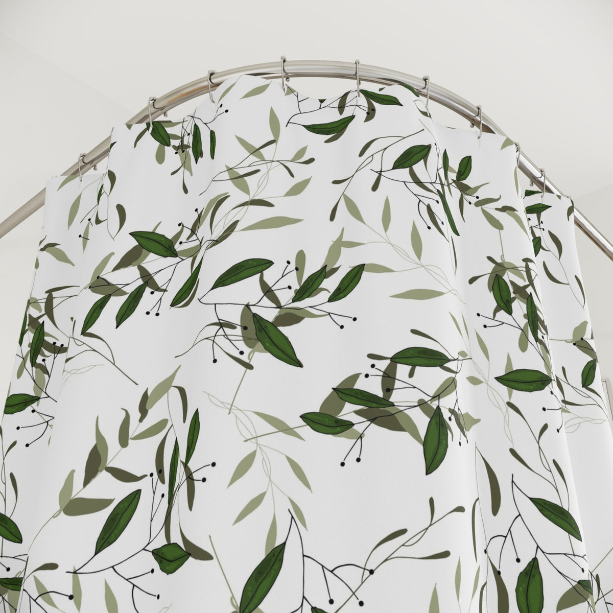 a shower curtain with a repeating pattern of green leaves and branches, creating a natural and organic design.