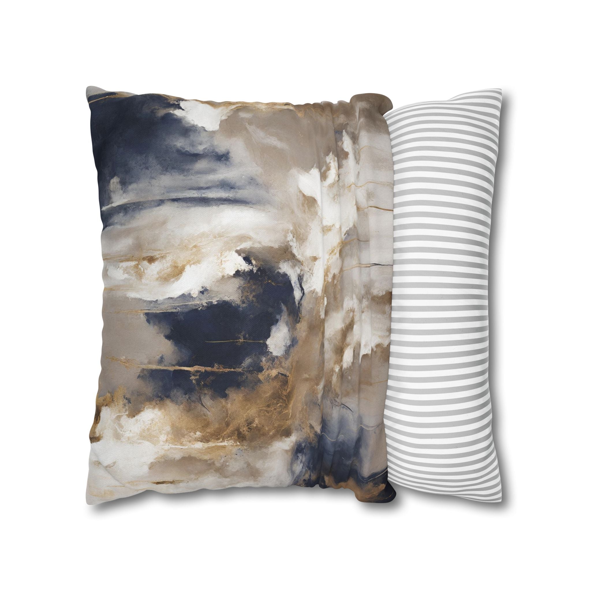 a square pillow with a striking abstract design in shades of blue, brown, and white. The design appears to be a blend of clouds and water, creating a sense of movement and depth. The pillow is placed on a white surface, which highlights its colors and design.