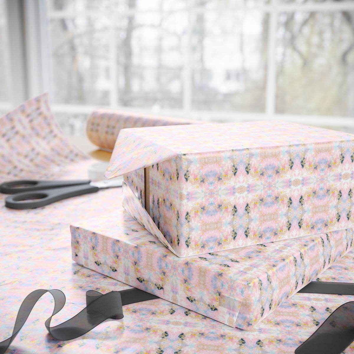 a close-up view of a pair of scissors on a table, with a stack of patterned gift boxes in the background.
