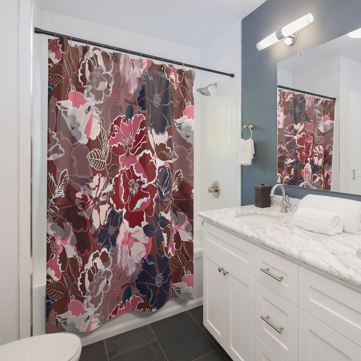 a modern bathroom with a white vanity, a large floral shower curtain, and a mirror above the vanity.