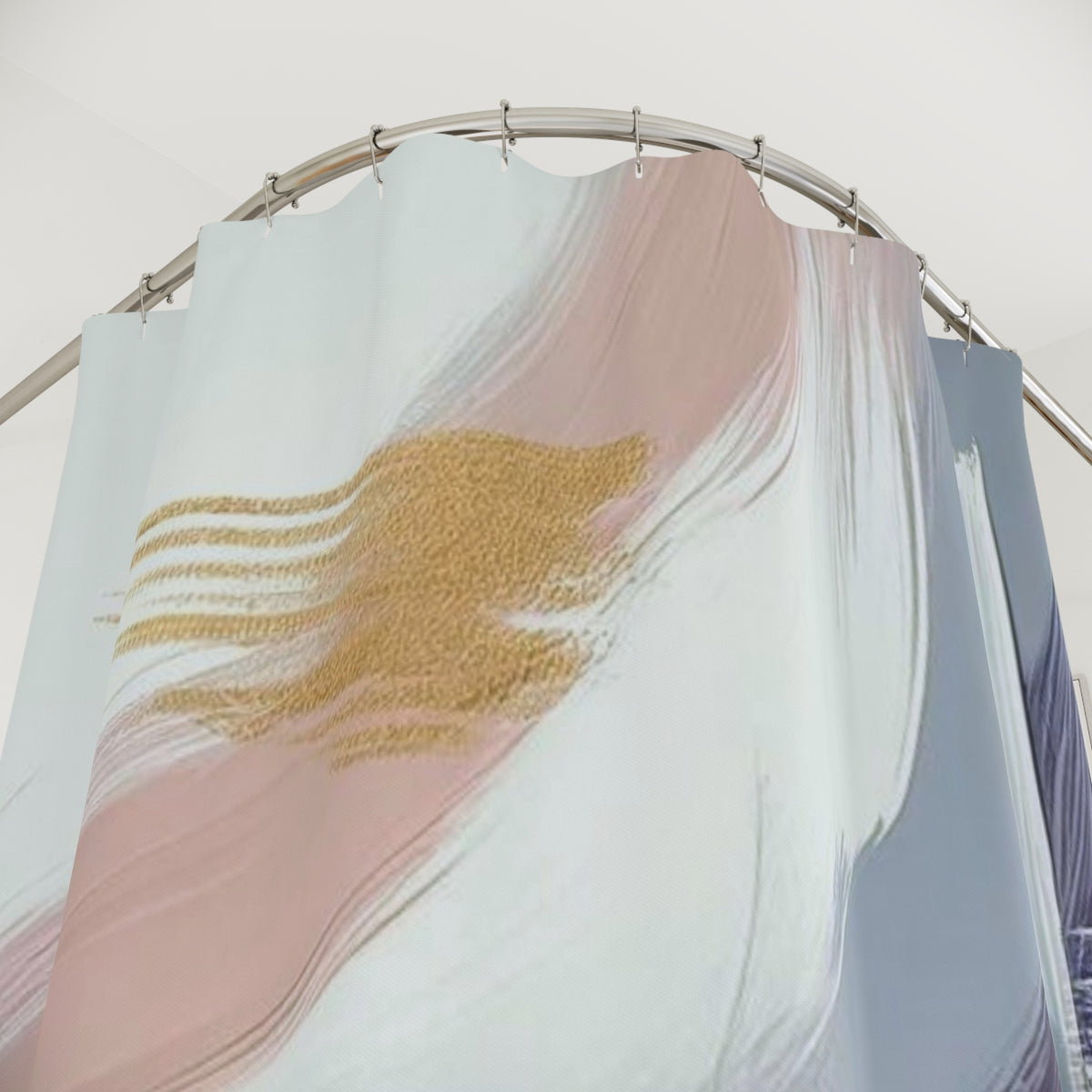 a shower curtain with a pink and white abstract design, including a gold-colored element.