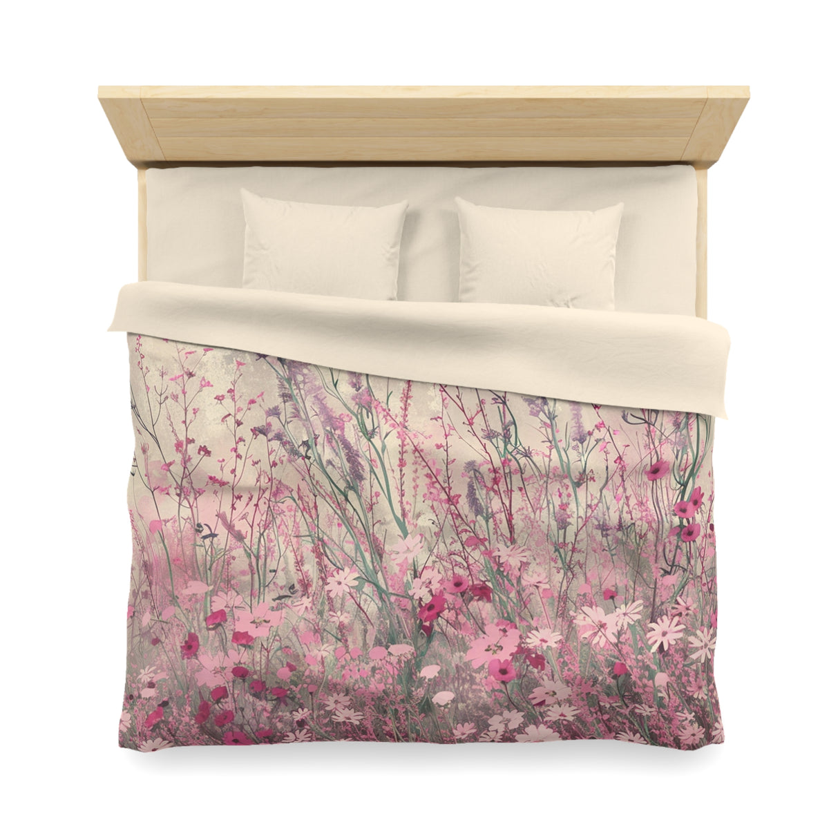a bed with a floral print duvet cover featuring a field of pink and white flowers.