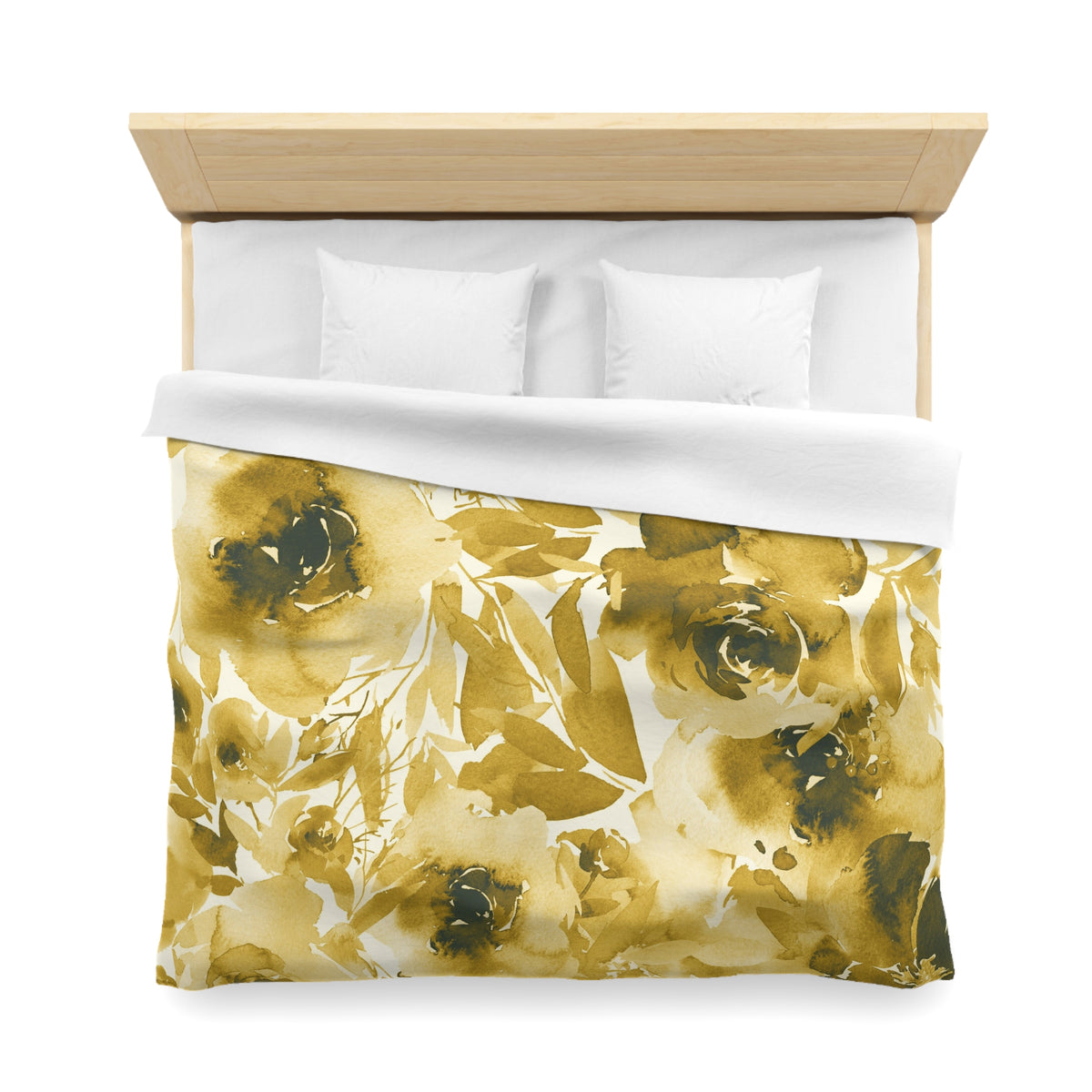 a bed with a floral print duvet cover and white pillows.