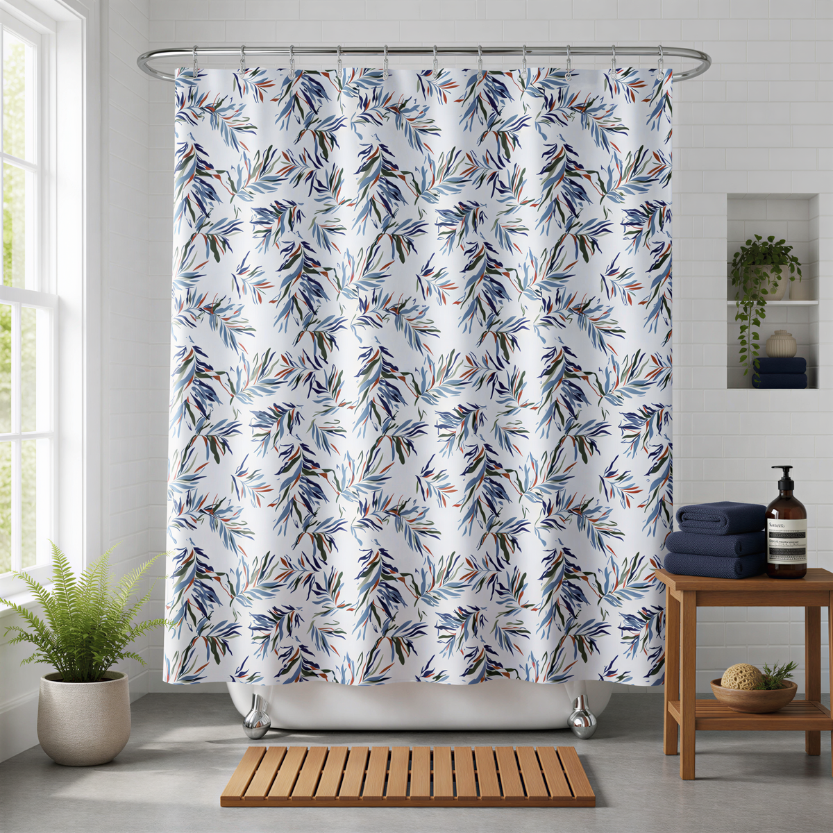 a bathroom with a white bathtub, a shower curtain with a leafy pattern, a wooden side table, and a potted plant.
