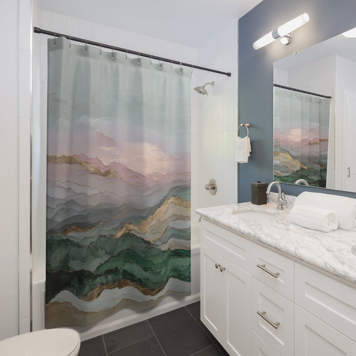 a modern bathroom with a white vanity, a shower curtain featuring a mountain landscape, and a mirror above the vanity.