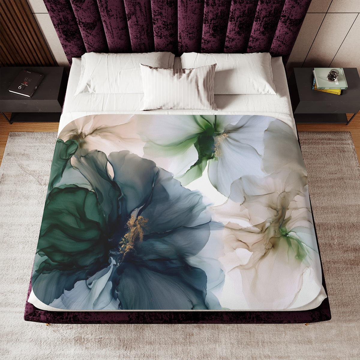 a bed with a floral comforter and pillows