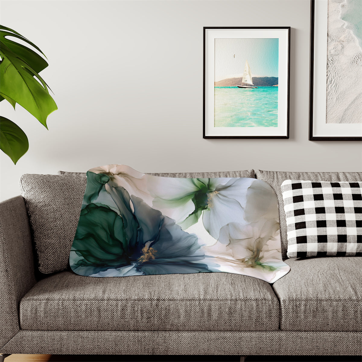 a living room with a couch and two pictures on the wall