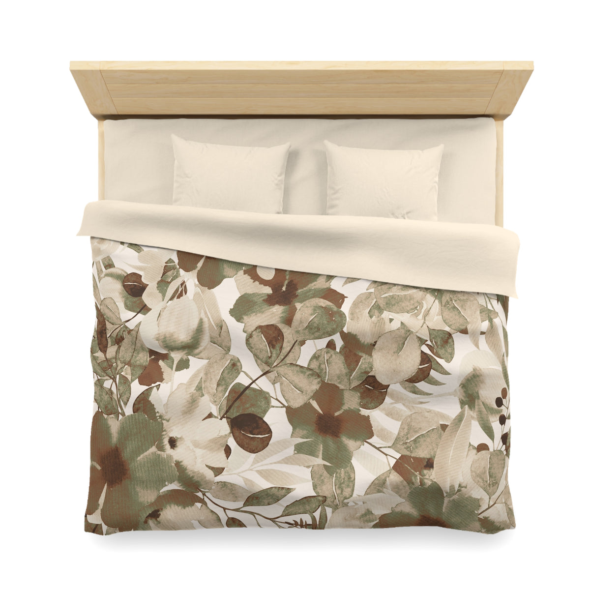 a neatly made bed with a floral print comforter and two pillows.