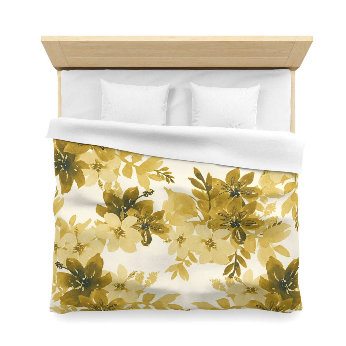 a bed with a floral print duvet cover and white pillows.