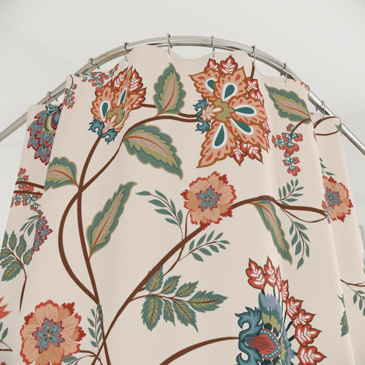 a shower curtain with a floral pattern in shades of orange, green, and blue.