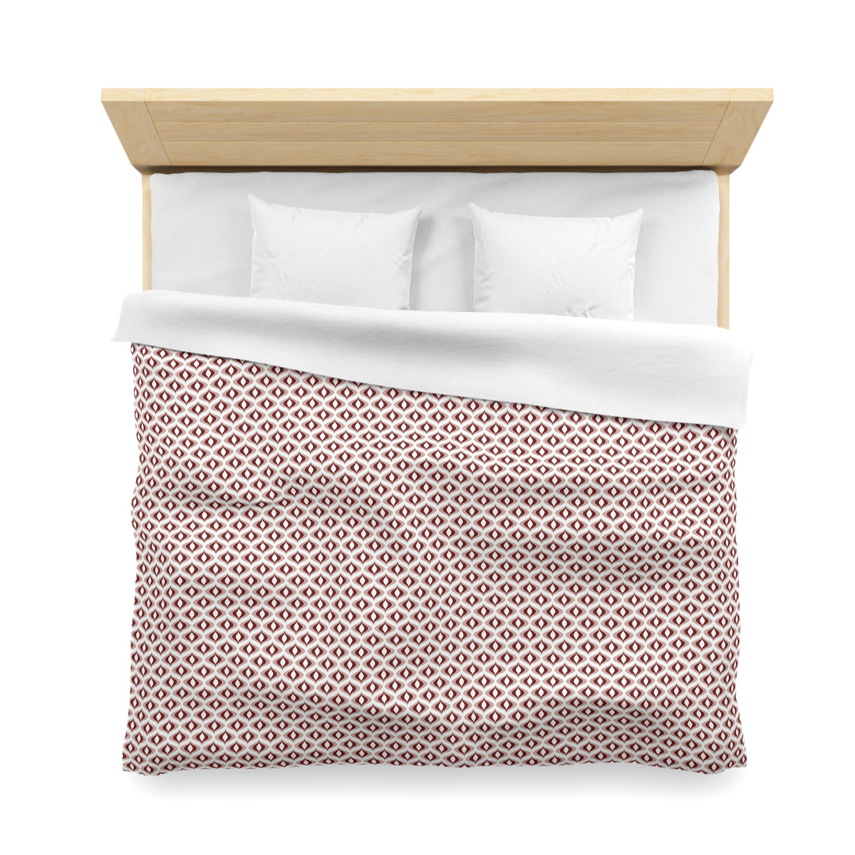 a neatly made bed with a white comforter and a red and white patterned blanket.