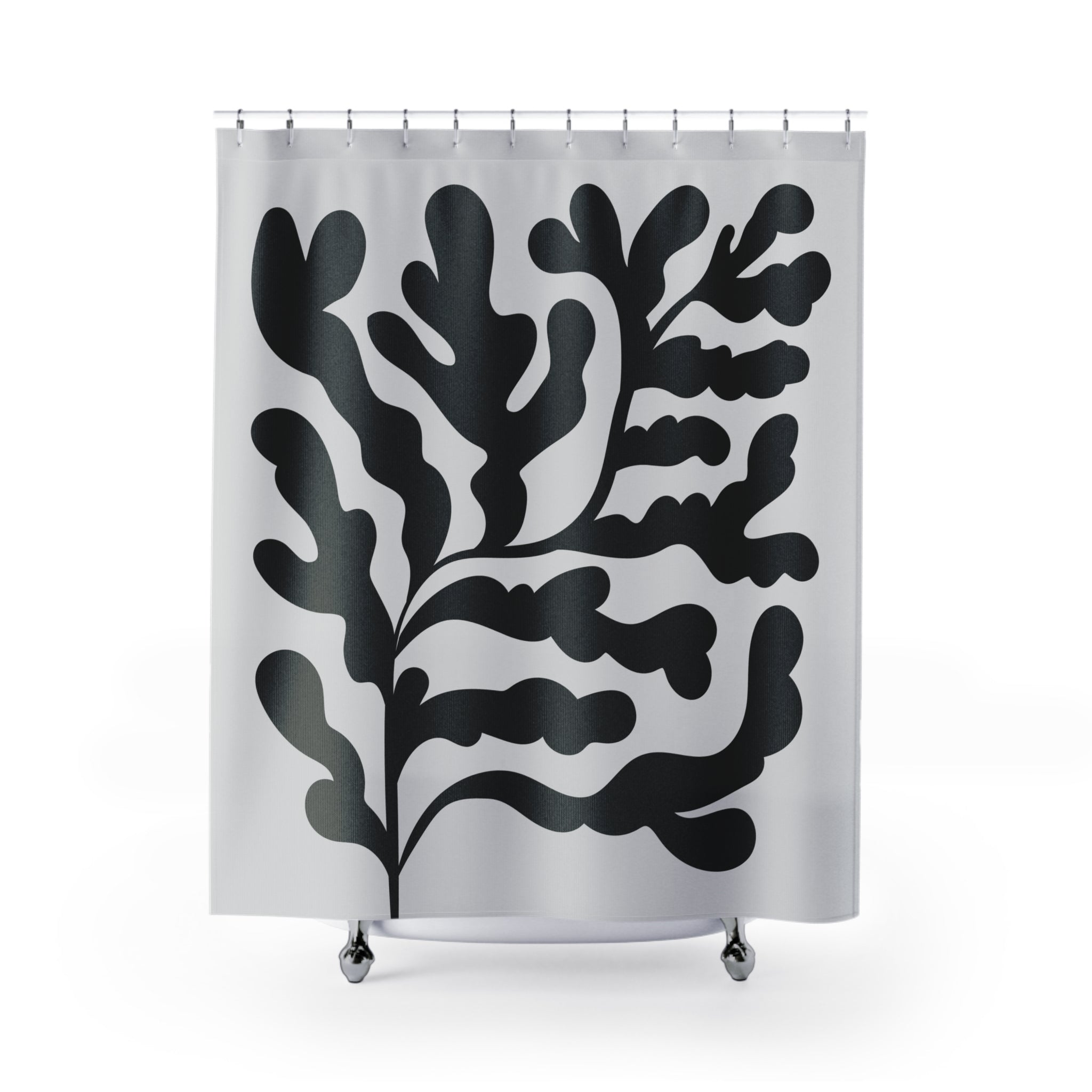 a shower curtain with a black and white design on it