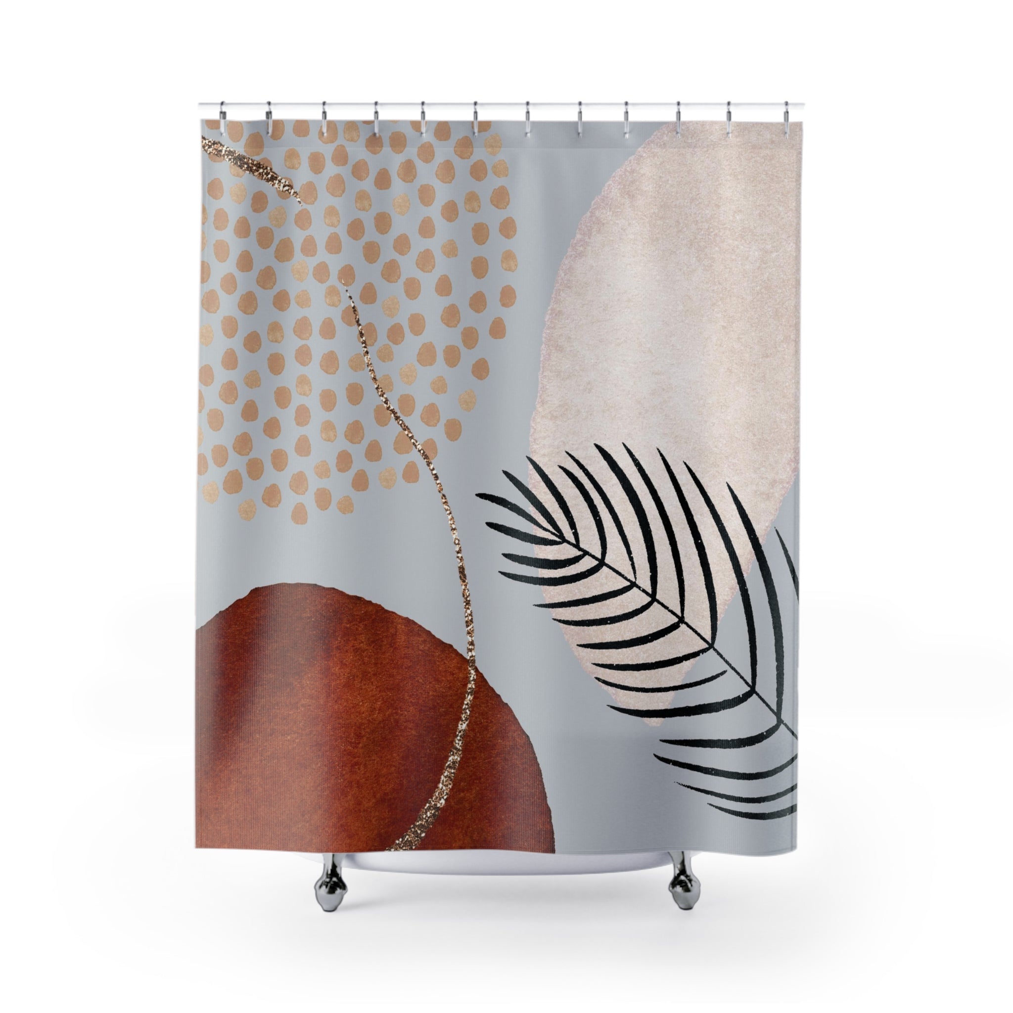 a shower curtain with a leaf and dots on it