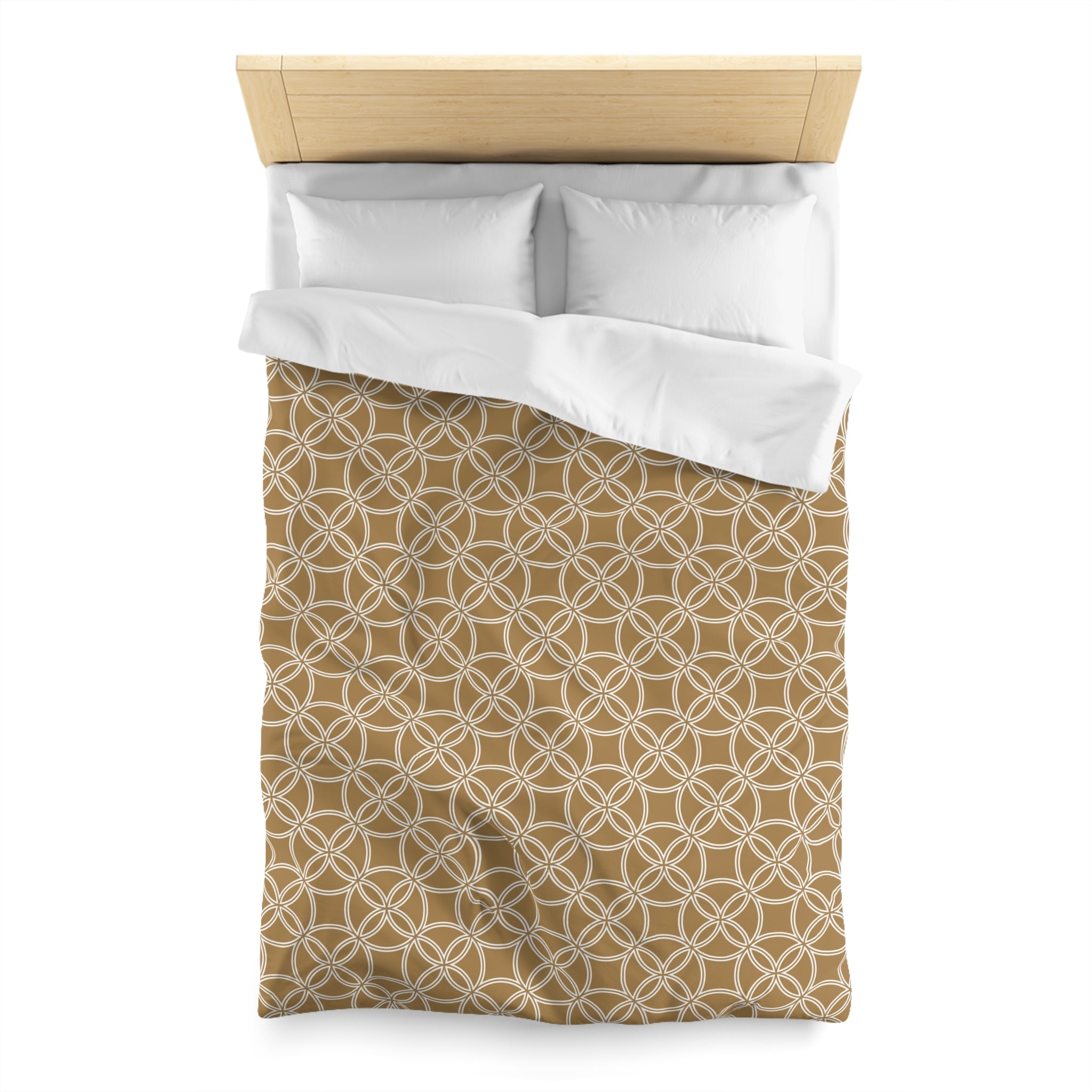 a neatly made bed with a brown and white patterned comforter and two white pillows.