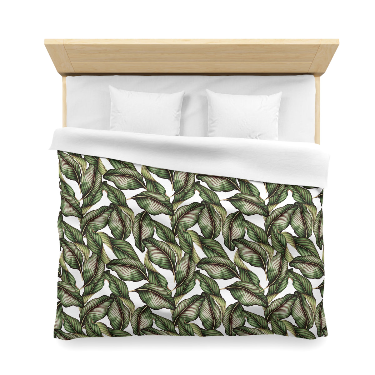 a neatly made bed with a white comforter and a patterned green and white leaf-like design on the bedding.