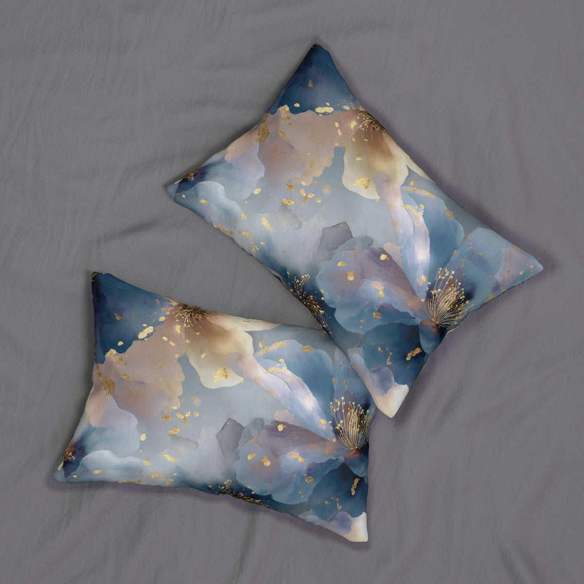 two decorative pillows with a floral pattern on a bed, featuring blue and gold colors.