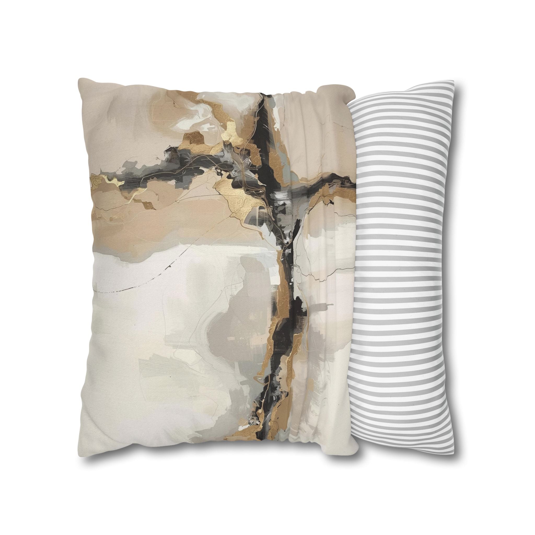 a square pillow with an abstract design, including a mix of brown, black, and white colors. The pillow is placed next to a striped pillow, creating a visually appealing contrast between the two.