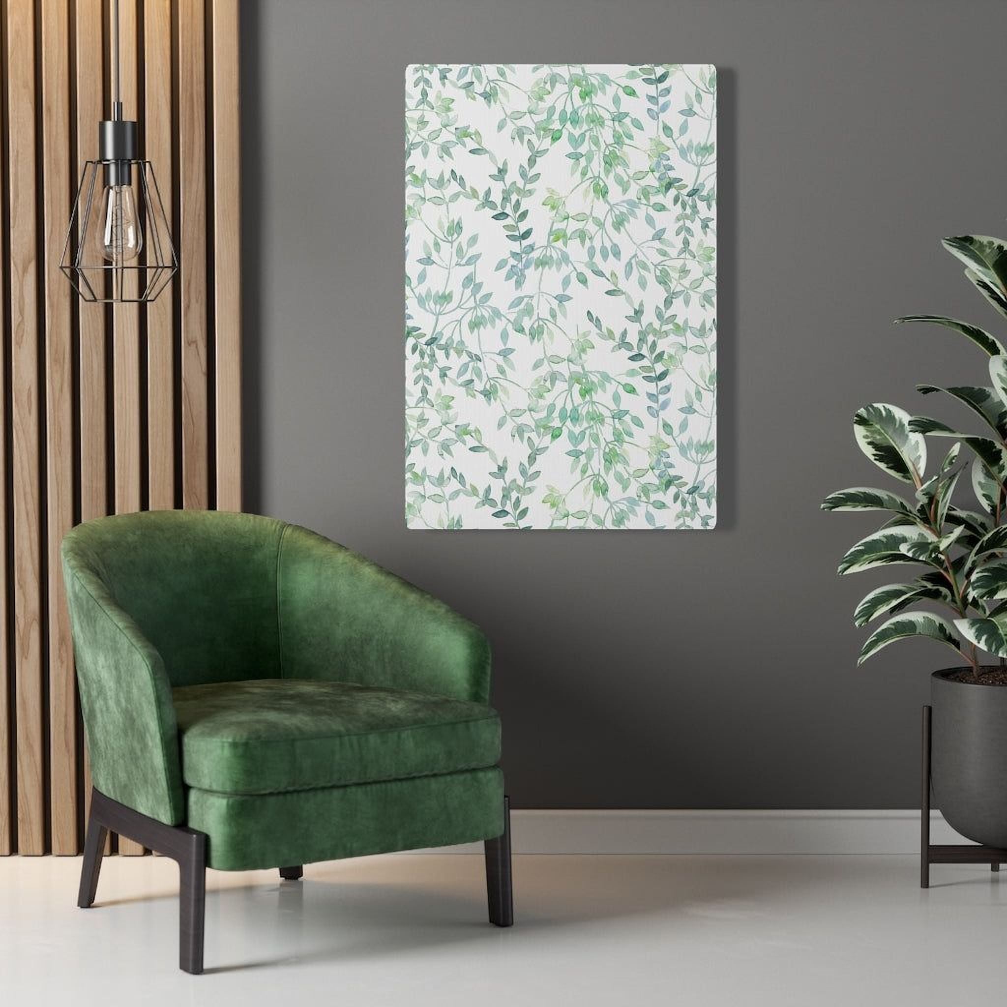 a modern living room with a green armchair, a potted plant, and a wall art piece with a leafy pattern.