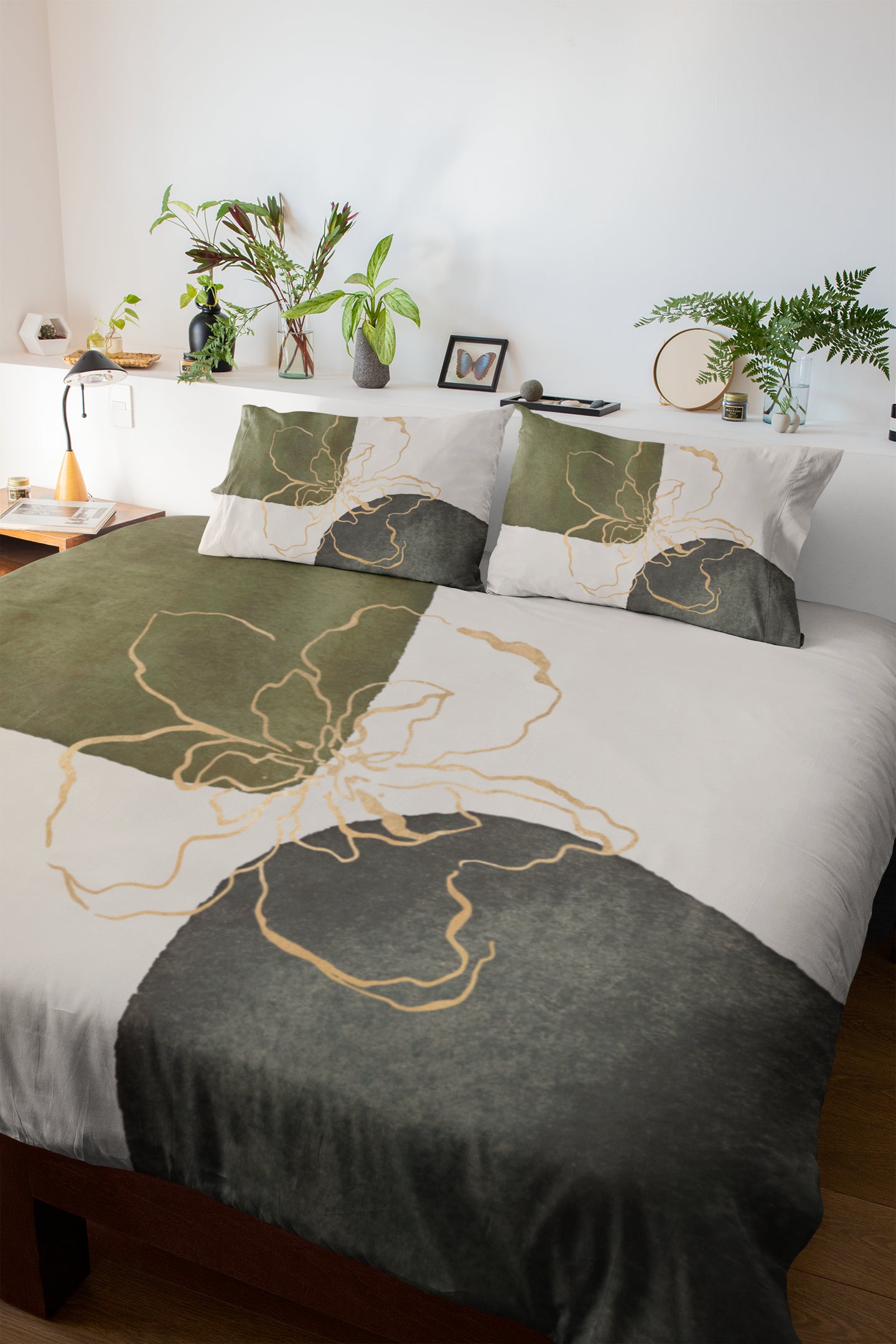 a bed with a green and white comforter and pillows