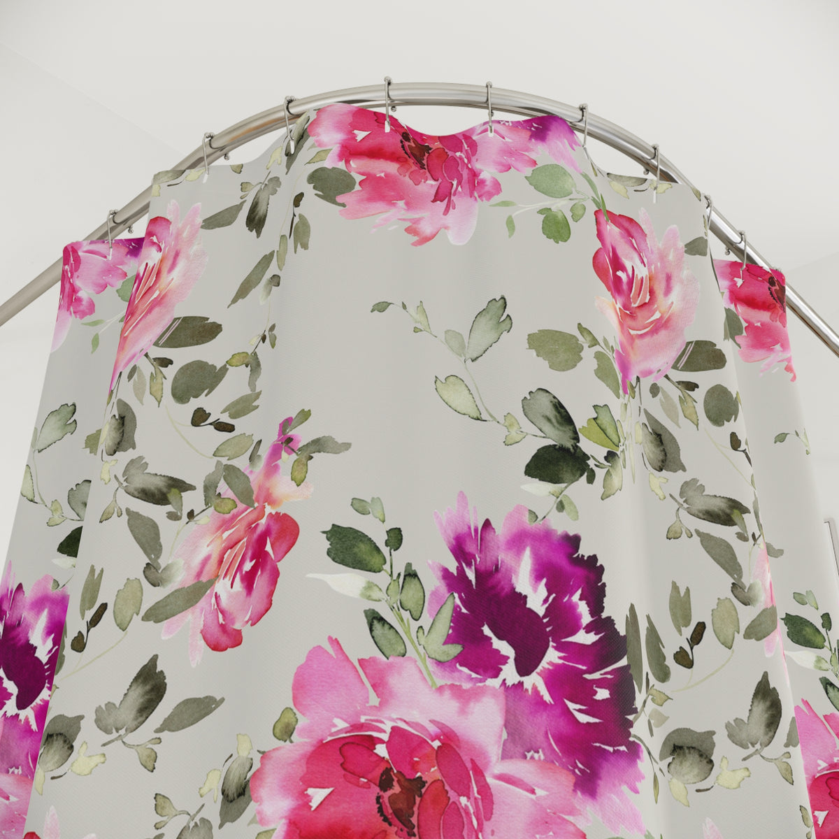 a shower curtain with a floral pattern of pink and green flowers.