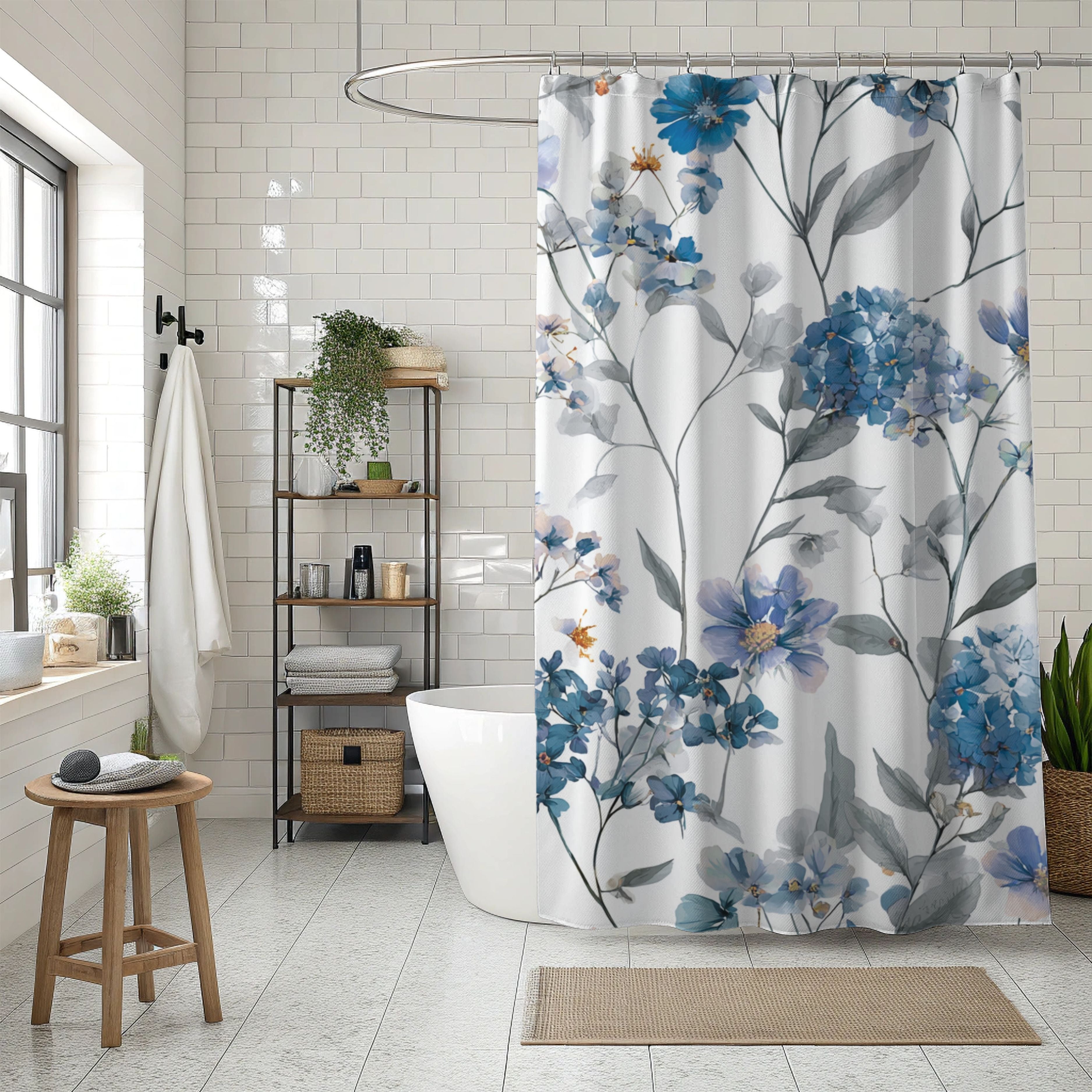 a modern bathroom with a floral patterned shower curtain, a white freestanding bathtub, and a wooden stool. The bathroom has white tiled walls and floor, and there are potted plants and other decorative elements, creating a serene and inviting atmosphere.