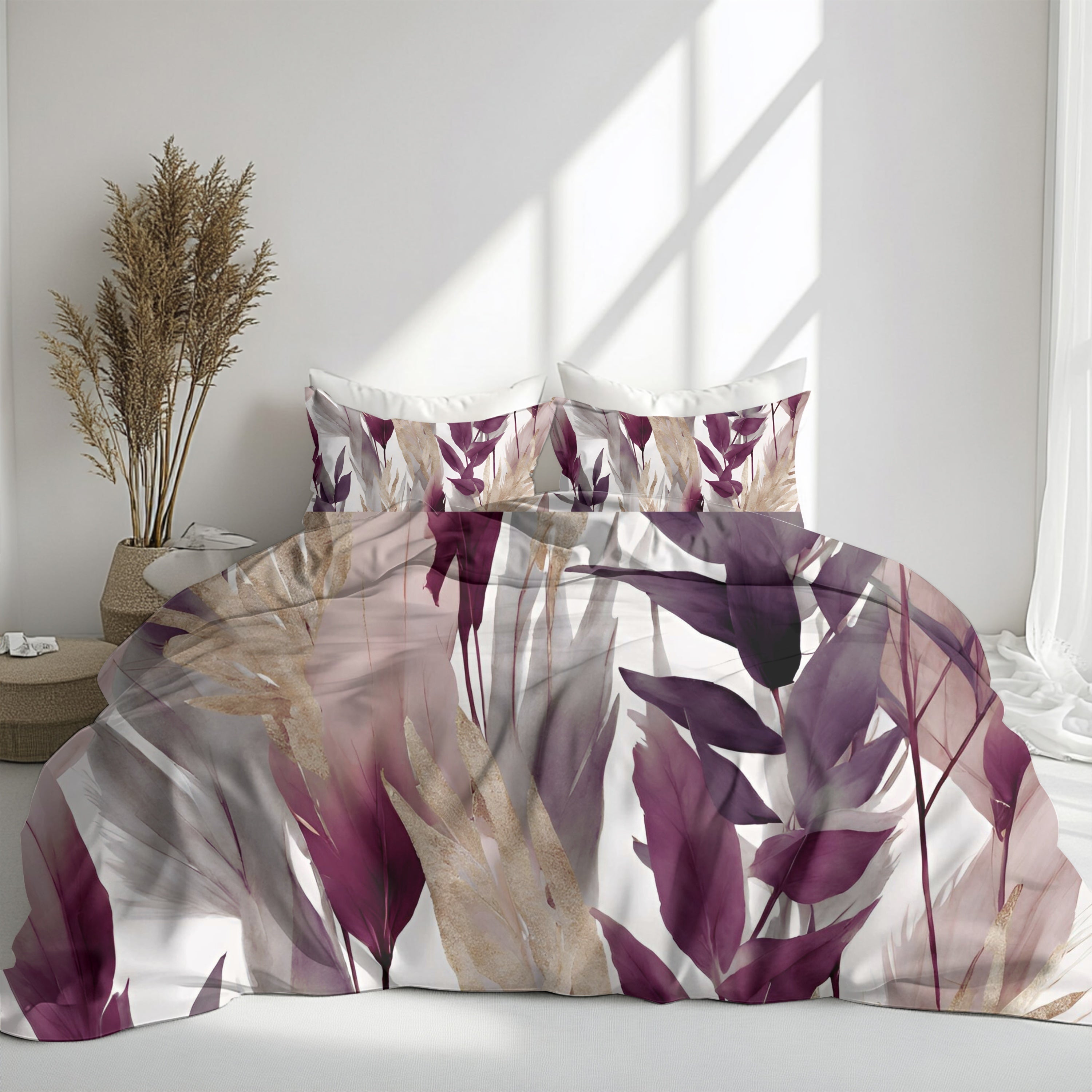 a bedroom with a bed adorned with a floral comforter and pillows. The bed is positioned against a white wall, and there is a window nearby. A potted plant is also visible in the room, adding a touch of greenery to the space.