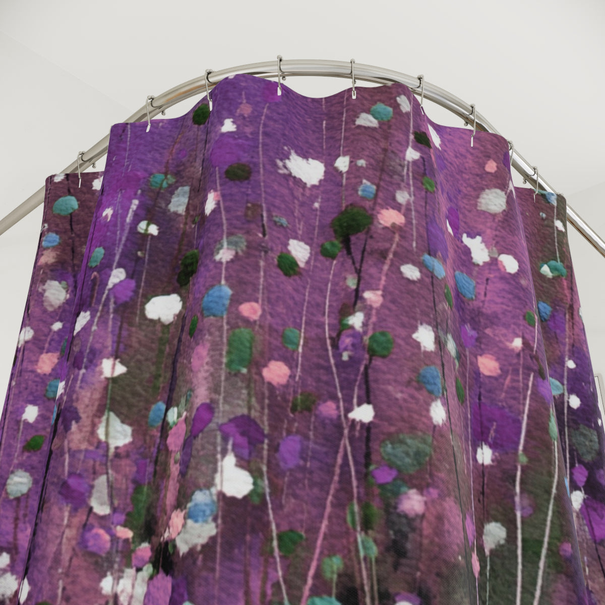 a vibrant purple shower curtain with a floral pattern, hanging from a rod.