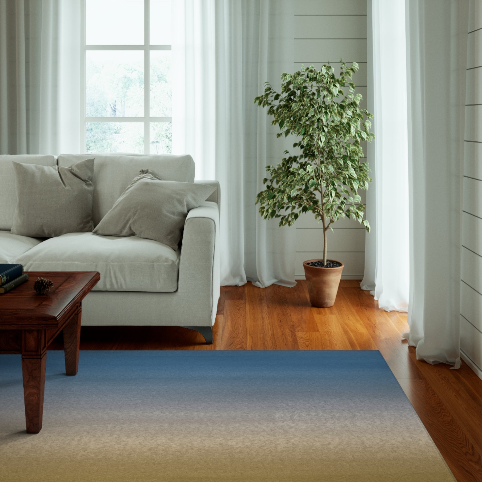 a living room with a couch, coffee table and a potted plant