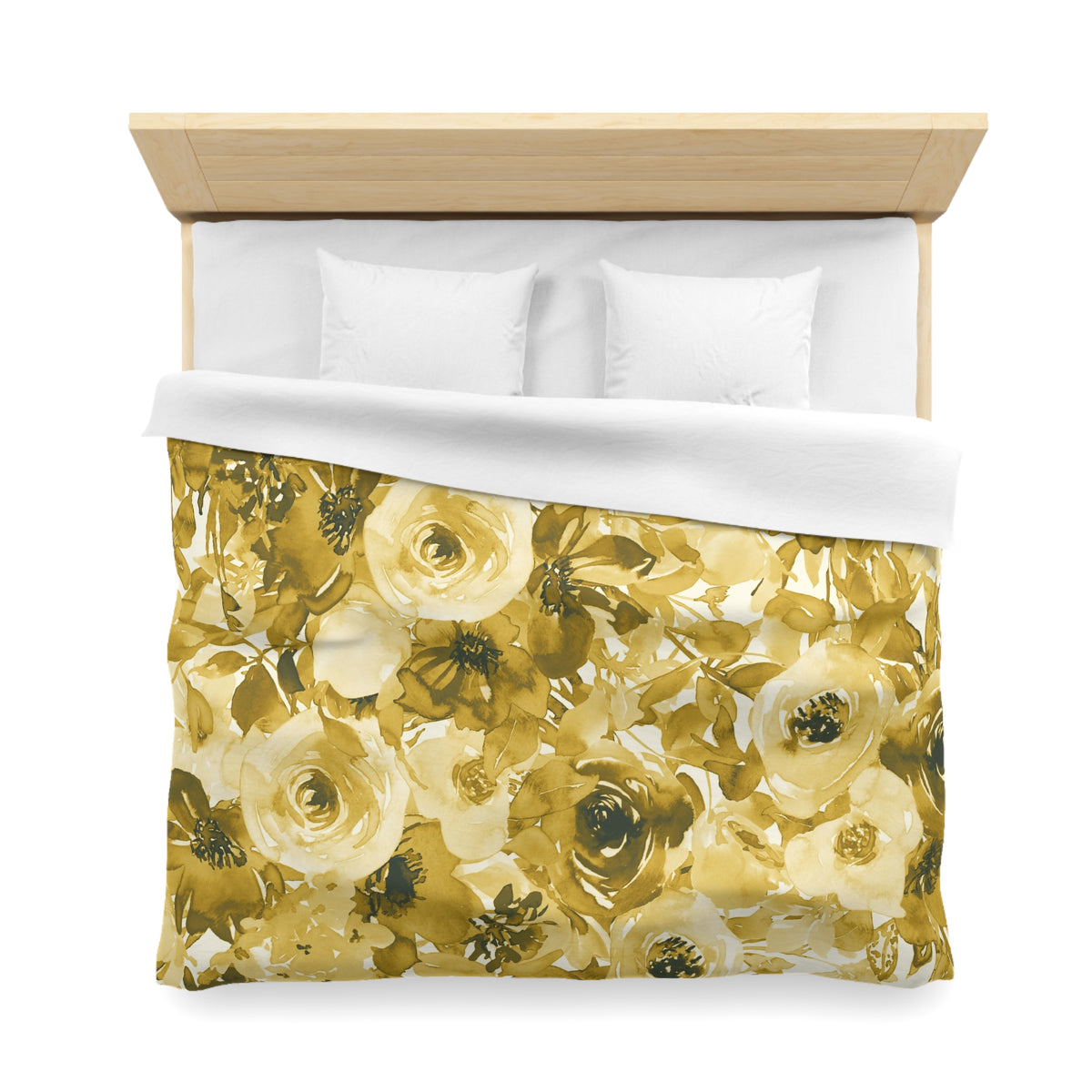 a bed with a floral print duvet cover and white pillows.
